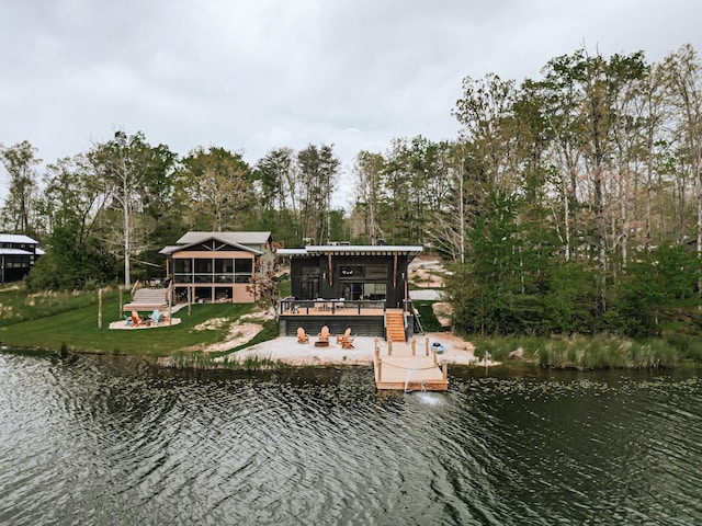 135 Hemlock Cv, Tracy City, TN 37387 - dock area featuring a lawn and a deck with water view