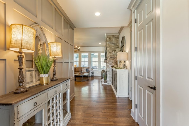 hallway with recessed lighting and dark wood-style flooring
