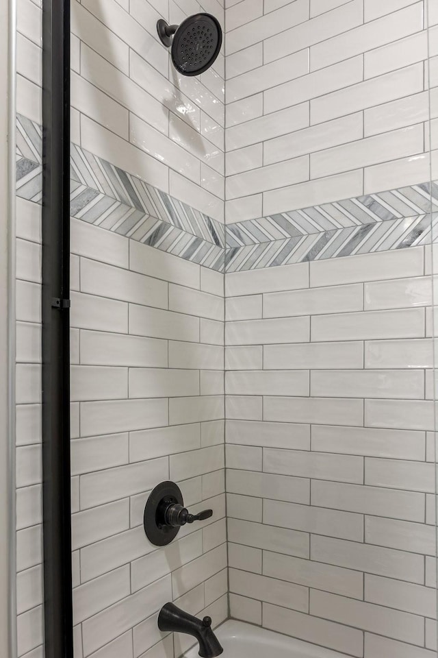 full bathroom with shower / tub combination