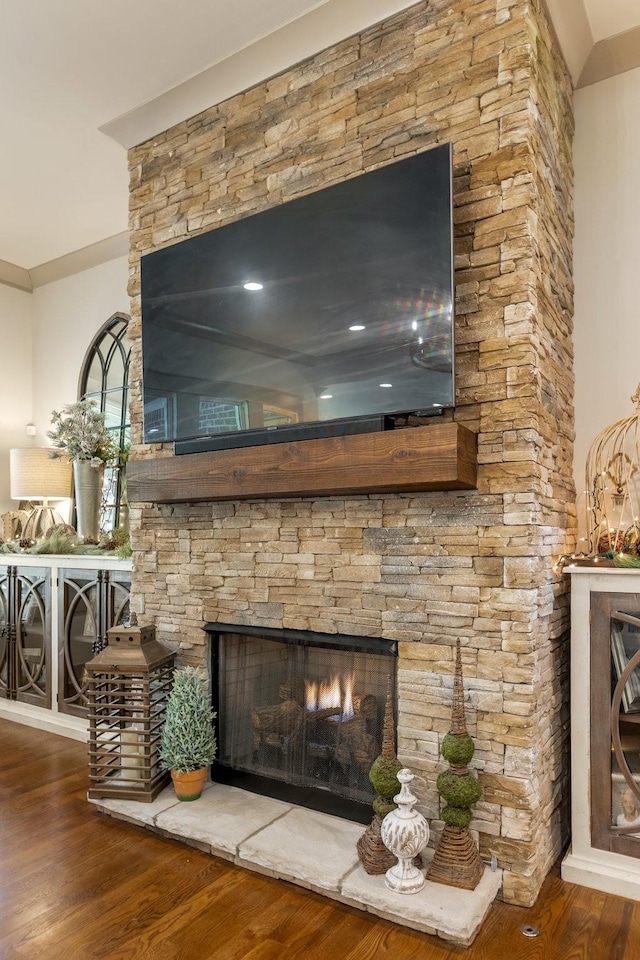 details with wood finished floors and a fireplace
