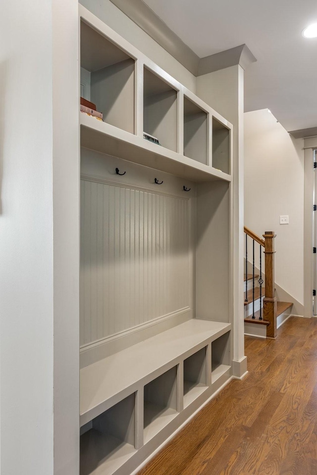 mudroom featuring baseboards, wood finished floors, and recessed lighting