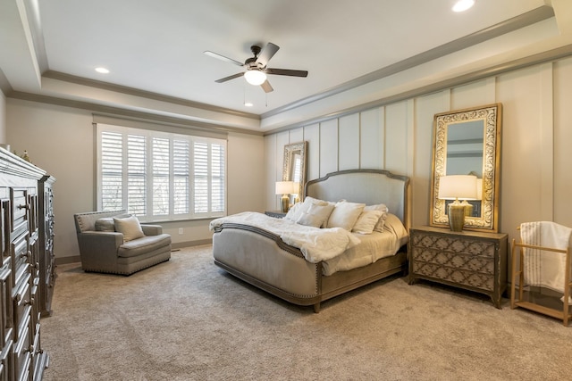 carpeted bedroom with baseboards, recessed lighting, and a raised ceiling