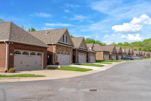 view of front of property with brick siding, a residential view, and concrete driveway
