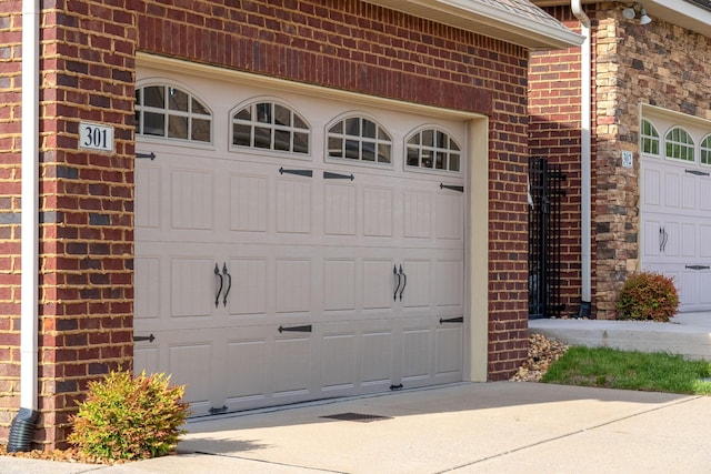 garage featuring driveway
