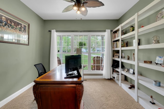 home office featuring baseboards, ceiling fan, and carpet flooring