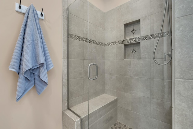 bathroom featuring a shower stall
