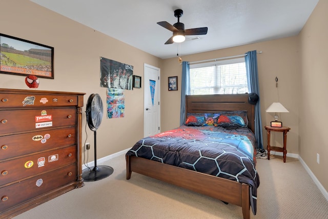 carpeted bedroom with baseboards and ceiling fan