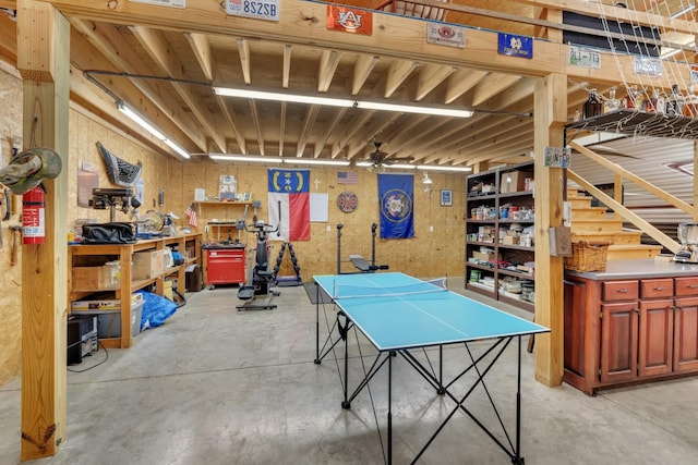 rec room featuring a ceiling fan and concrete flooring