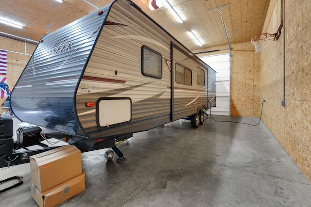 garage featuring wooden walls