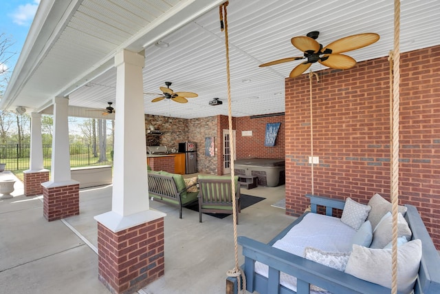 view of patio / terrace with area for grilling, an outdoor living space, ceiling fan, and fence