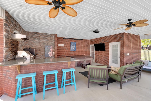 view of patio / terrace with a ceiling fan, outdoor wet bar, and an outdoor hangout area
