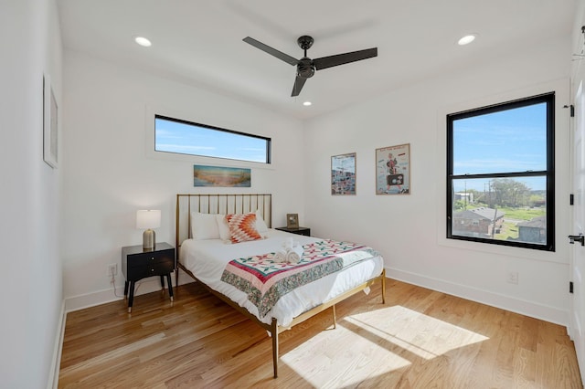 bedroom with light wood-style flooring, baseboards, recessed lighting, and ceiling fan