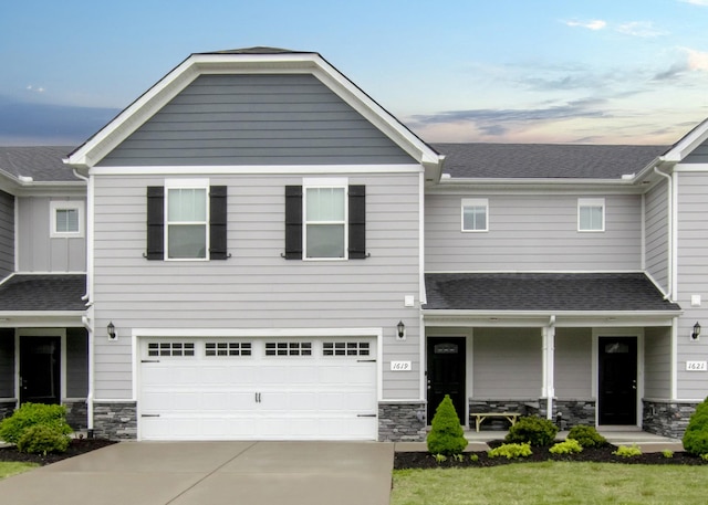 1619 Calypso Dr, Murfreesboro, TN 37128 - view of front facade featuring stone siding, concrete driveway, a garage, a porch, and a shingled roof
