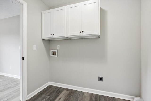 1212 Hollis Ln, Lafayette, TN 37083 - laundry area with hookup for a washing machine, hookup for an electric dryer, cabinet space, baseboards, and dark wood-style flooring
