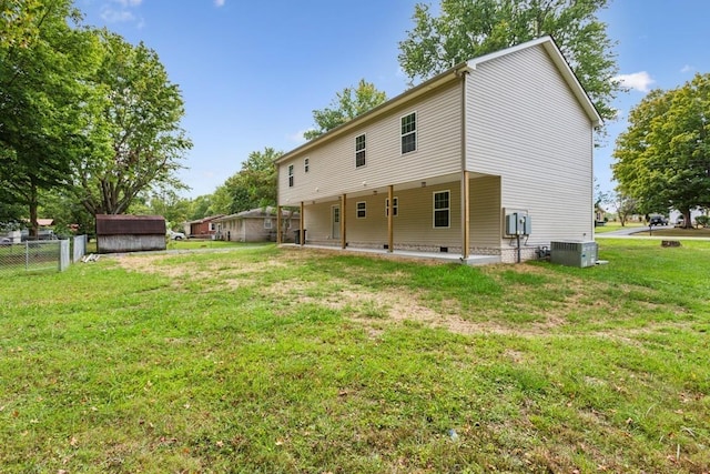 1212 Hollis Ln, Lafayette, TN 37083 - back of property with crawl space, a shed, fence, a yard, and cooling unit