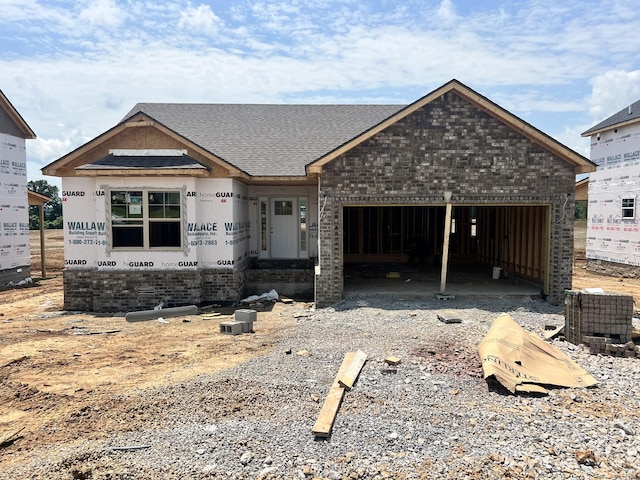 7 Hugh Hunter Rd, Oak Grove, KY 42262 - property in mid-construction with brick siding, a garage, roof with shingles, and central AC unit