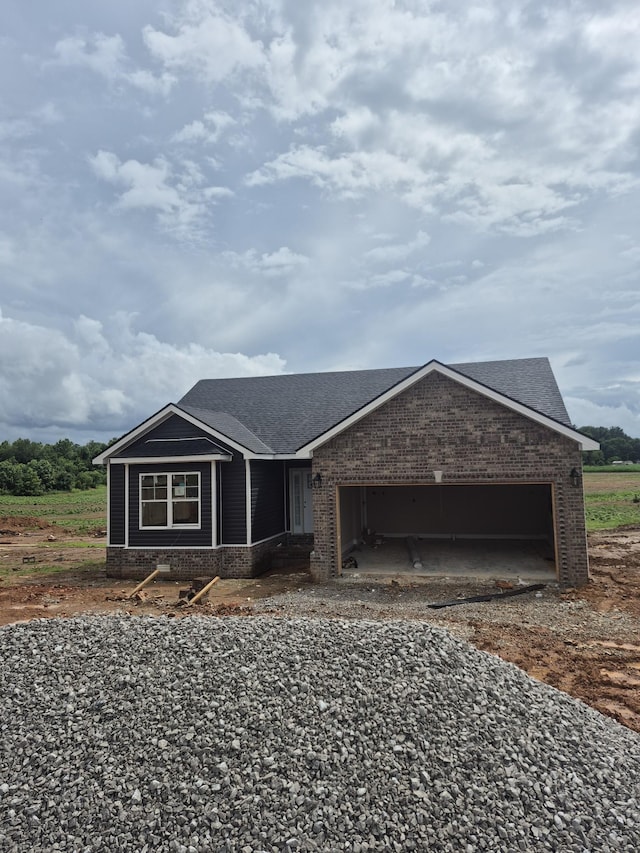 5 Hugh Hunter Rd, Oak Grove, KY 42262 - view of front of house featuring an attached garage, a shingled roof, brick siding, and driveway
