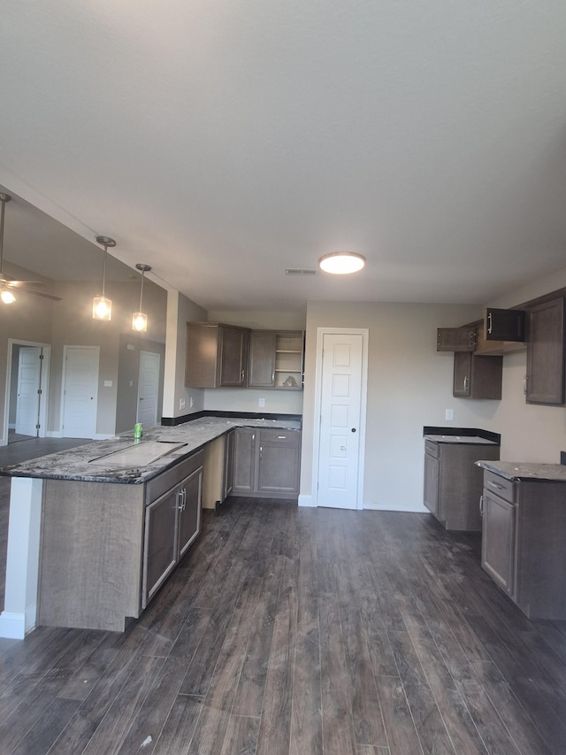 5 Hugh Hunter Rd, Oak Grove, KY 42262 - kitchen featuring dark wood finished floors, a peninsula, and decorative light fixtures