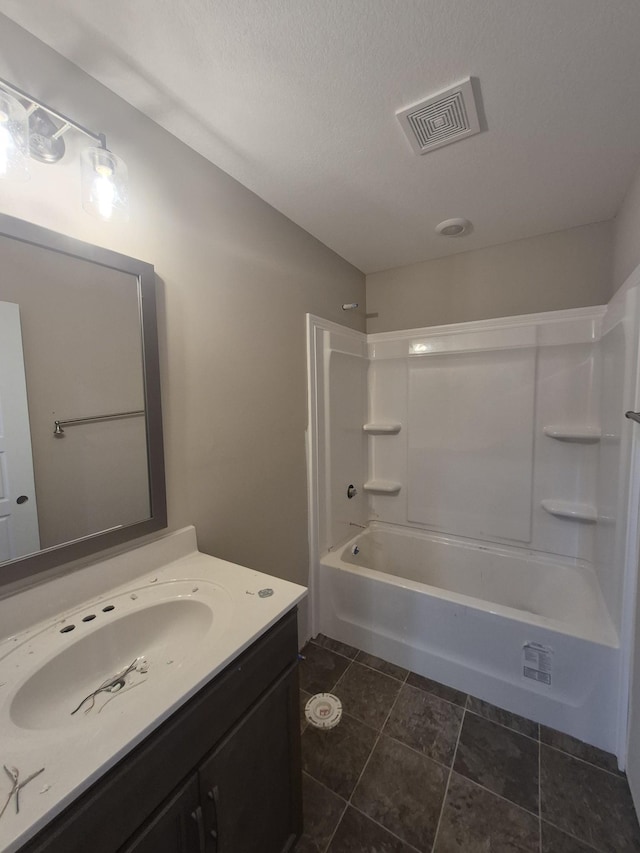 5 Hugh Hunter Rd, Oak Grove, KY 42262 - bathroom with vanity,  shower combination, and a textured ceiling