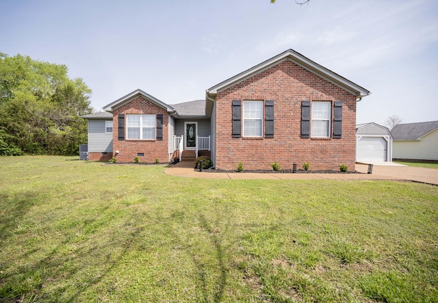 ranch-style home with a detached garage, a front lawn, driveway, an outbuilding, and brick siding