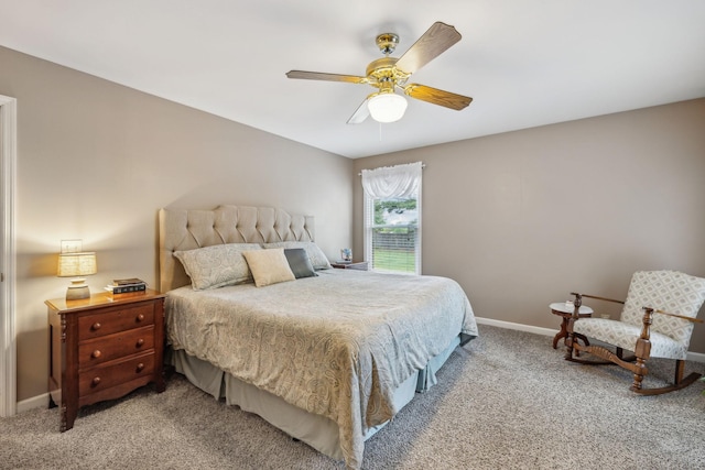 bedroom featuring ceiling fan, baseboards, and light carpet