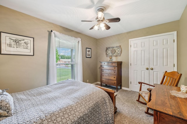 bedroom featuring baseboards, a ceiling fan, carpet flooring, and a closet