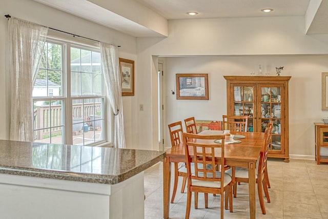 dining space with recessed lighting and light tile patterned flooring