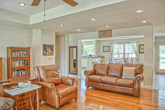 living area with plenty of natural light, recessed lighting, and light wood-type flooring