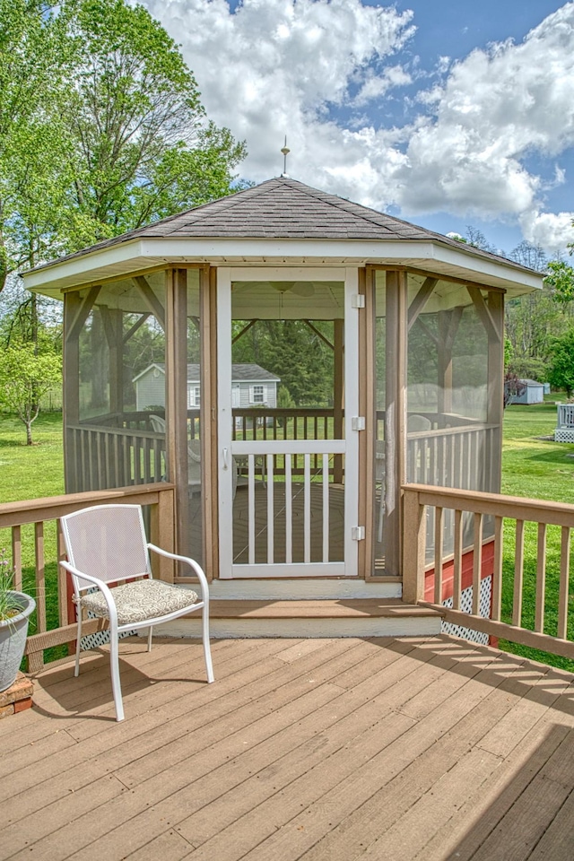 wooden deck featuring a sunroom