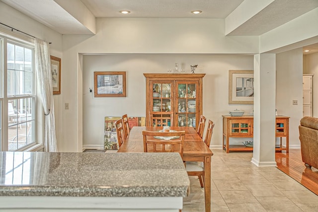dining room featuring recessed lighting, baseboards, and light tile patterned floors