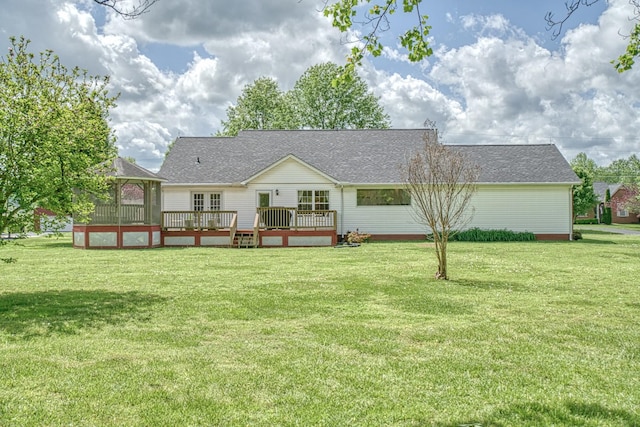 back of house with a lawn, a gazebo, a wooden deck, and roof with shingles