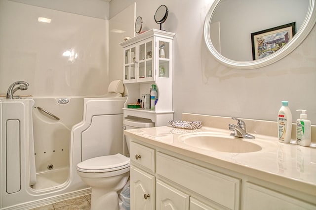 full bathroom with toilet, tile patterned floors, vanity, and a whirlpool tub