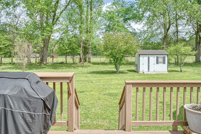 view of yard with a storage shed, an outbuilding, and a fenced backyard