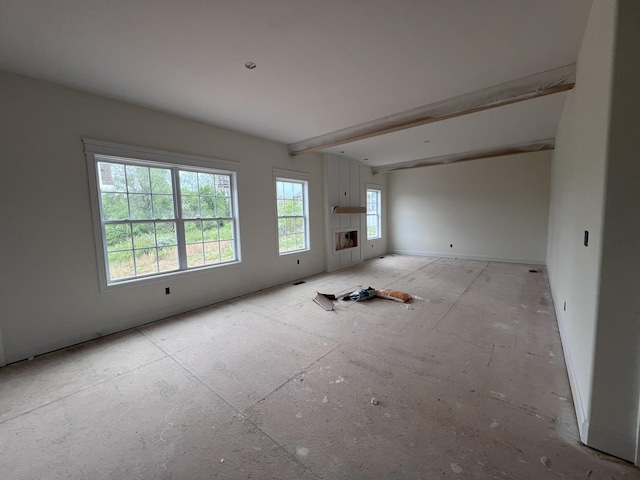 spare room with beam ceiling