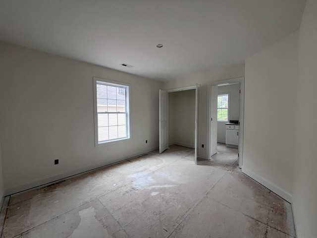 unfurnished bedroom with visible vents