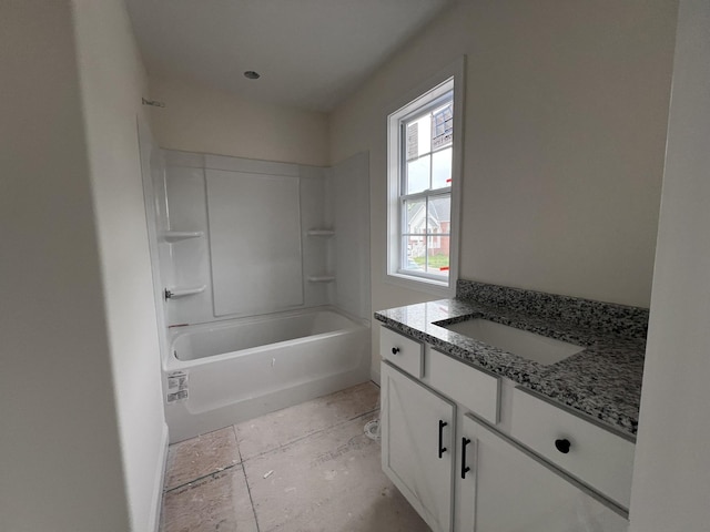 bathroom featuring bathtub / shower combination and vanity