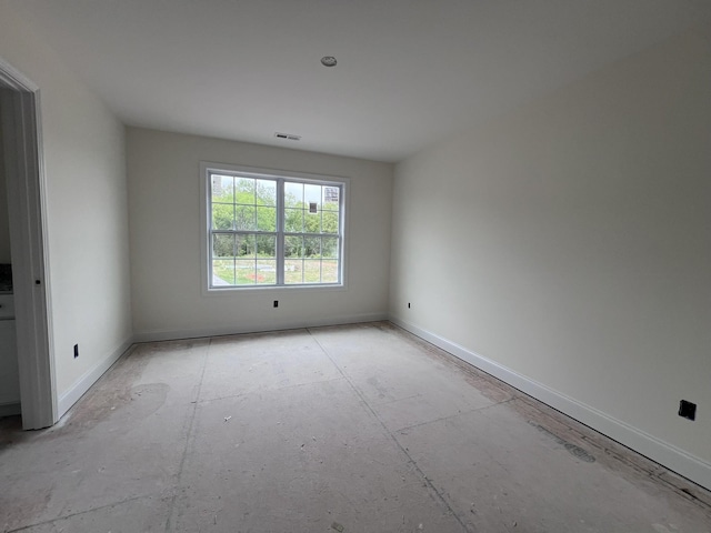 spare room with visible vents and baseboards