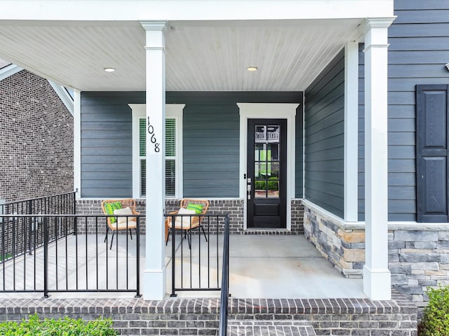 1068 Amelia Park Dr, Franklin, TN 37067 - doorway to property featuring a porch and stone siding