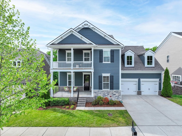 1068 Amelia Park Dr, Franklin, TN 37067 - view of front of property featuring a front lawn, concrete driveway, covered porch, a garage, and a balcony