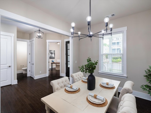 1068 Amelia Park Dr, Franklin, TN 37067 - dining area with dark wood-style flooring, visible vents, baseboards, and a notable chandelier