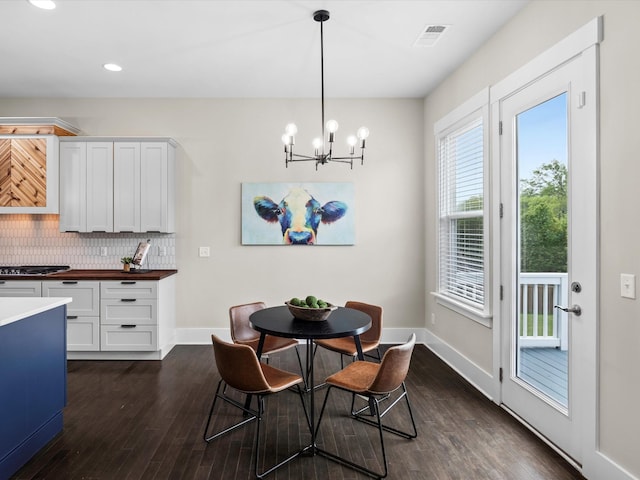1068 Amelia Park Dr, Franklin, TN 37067 - dining area featuring dark wood-style flooring, baseboards, visible vents, recessed lighting, and a chandelier