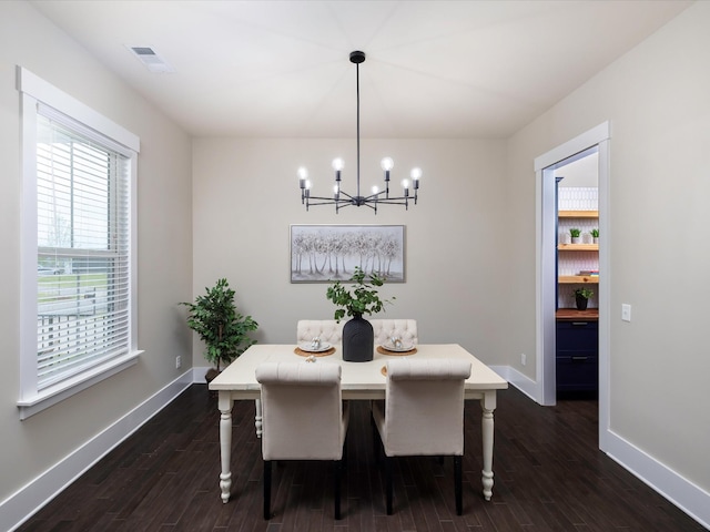 1068 Amelia Park Dr, Franklin, TN 37067 - dining area featuring an inviting chandelier, dark wood-type flooring, visible vents, and a wealth of natural light