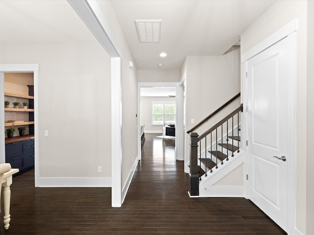 1068 Amelia Park Dr, Franklin, TN 37067 - hall with stairs, baseboards, visible vents, and dark wood-type flooring