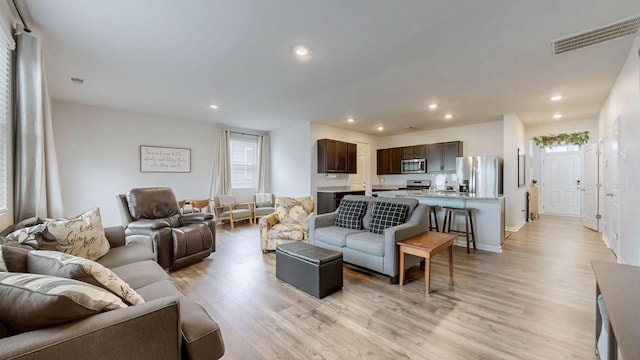 615 Pine Bloom Rd, Lebanon, TN 37087 - living room with light wood finished floors, baseboards, visible vents, and recessed lighting
