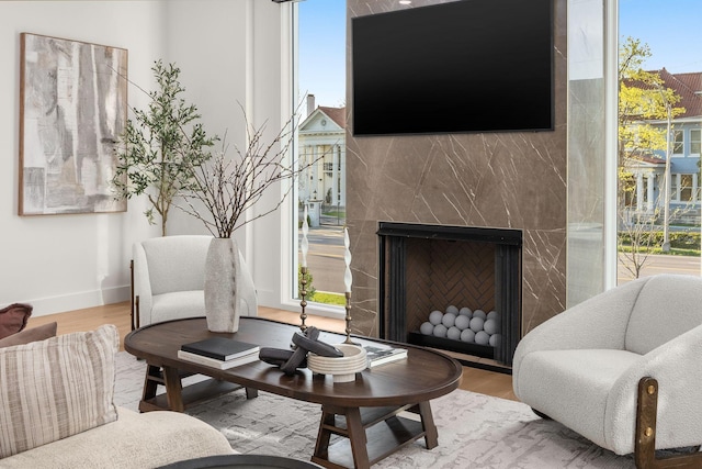 living area with a wealth of natural light and wood finished floors