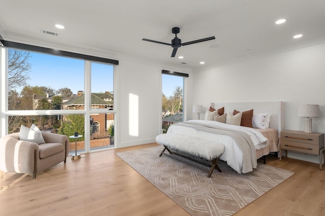 bedroom featuring recessed lighting, access to outside, light wood-type flooring, visible vents, and crown molding