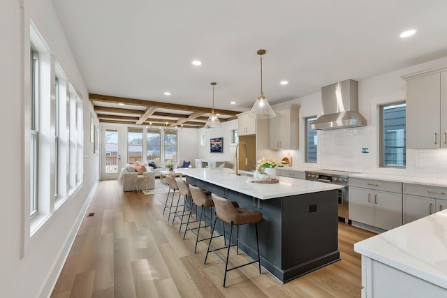 620 Waco Dr Unit B, Nashville, TN 37209 - kitchen featuring recessed lighting, open floor plan, wall chimney range hood, and decorative backsplash