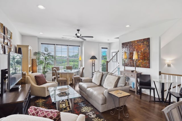 living area with dark wood-style floors, recessed lighting, ceiling fan, and stairway