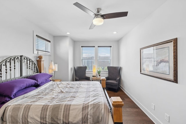 bedroom featuring dark wood-style floors, recessed lighting, multiple windows, and baseboards