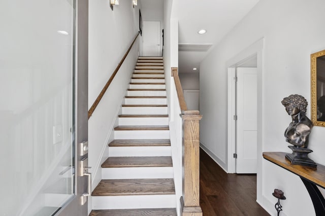 stairs featuring recessed lighting and wood finished floors